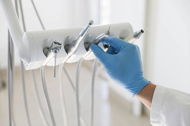 Professional Tooth Extraction technician working in Gulfport, MS